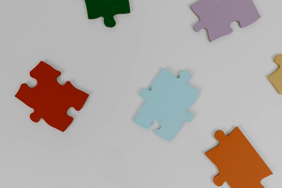Image illustrating Trait Leadership Theory, showcasing puzzle pieces with different traits as elements of leadership, symbolizing the theory's concept.